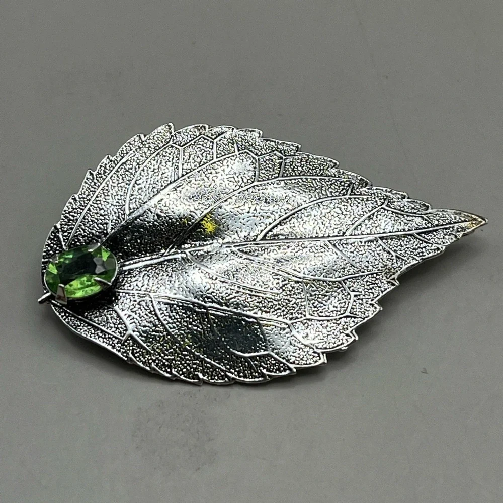 Silver Leaf Brooch with Green Gem